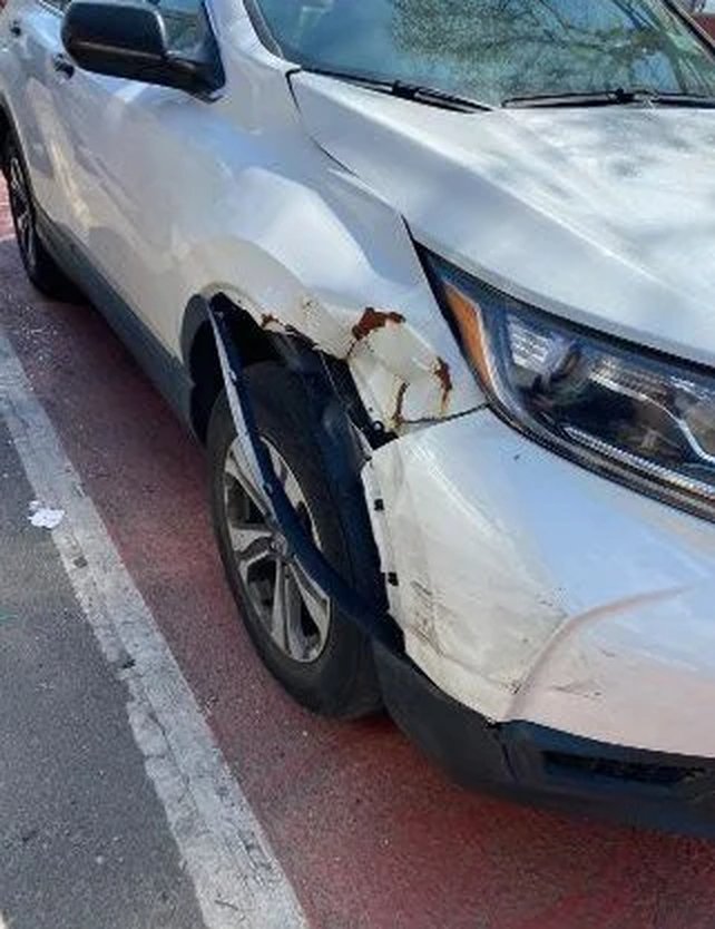 Honda CR-V before repair with a crumpled fender and bumper